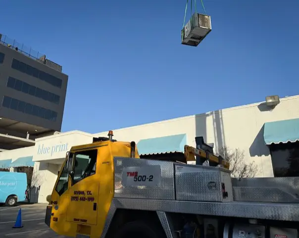 Installing a commercial HVAC unit.